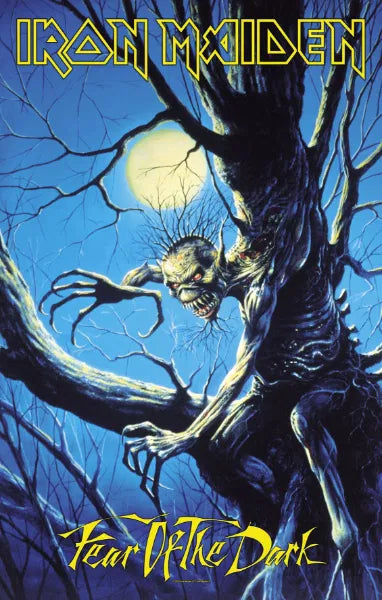 Album cover for Iron Maiden's 'Fear of the Dark' with a dark creature and moon in the background.
